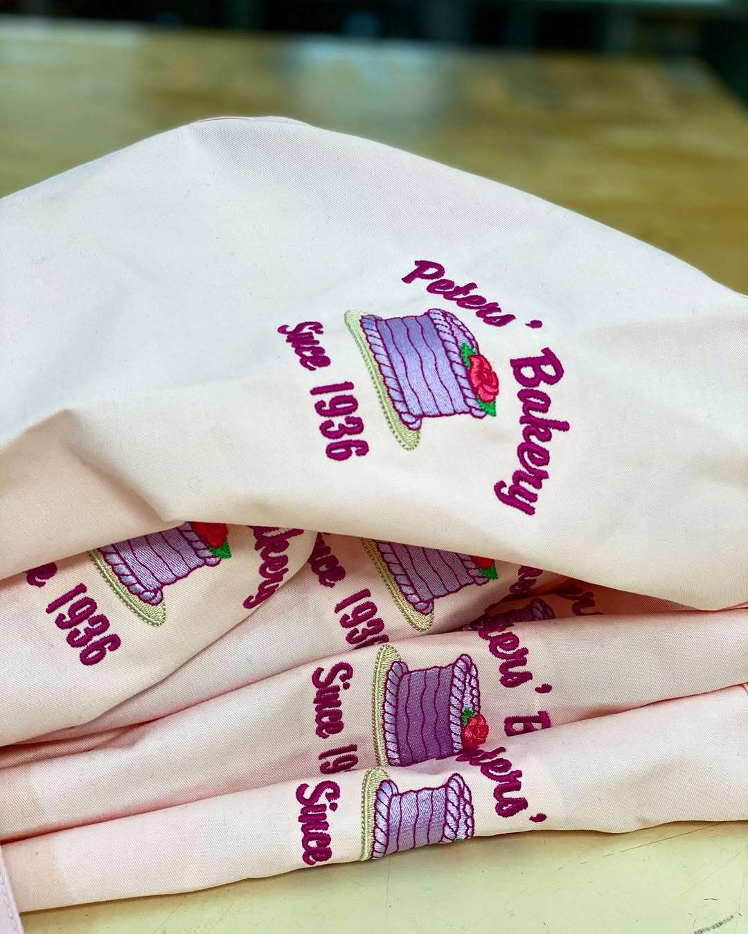 Custom embroidered aprons for a bakery client